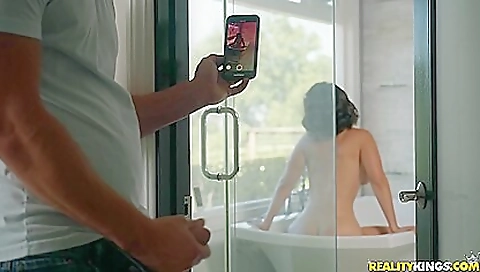 Big-assed brunette caught masturbating in the shower