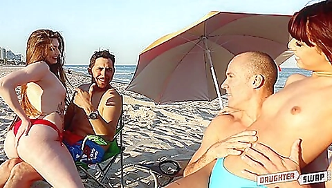 Long-haired woman is deep throating while fucked by a guy