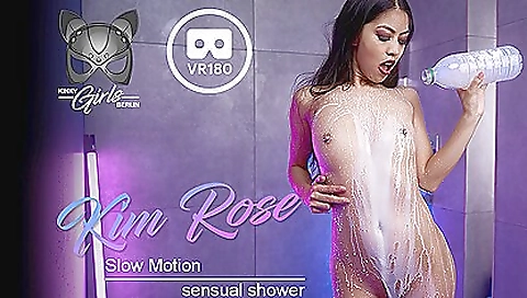 Shaved brunette in a sexy dress enjoys a sexy shower