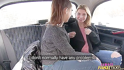 Sexy lesbian milf in a sexy dress with a strap on riding a taxi